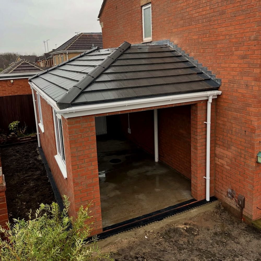 Brick carport with matching tiled roofline, attached to the house