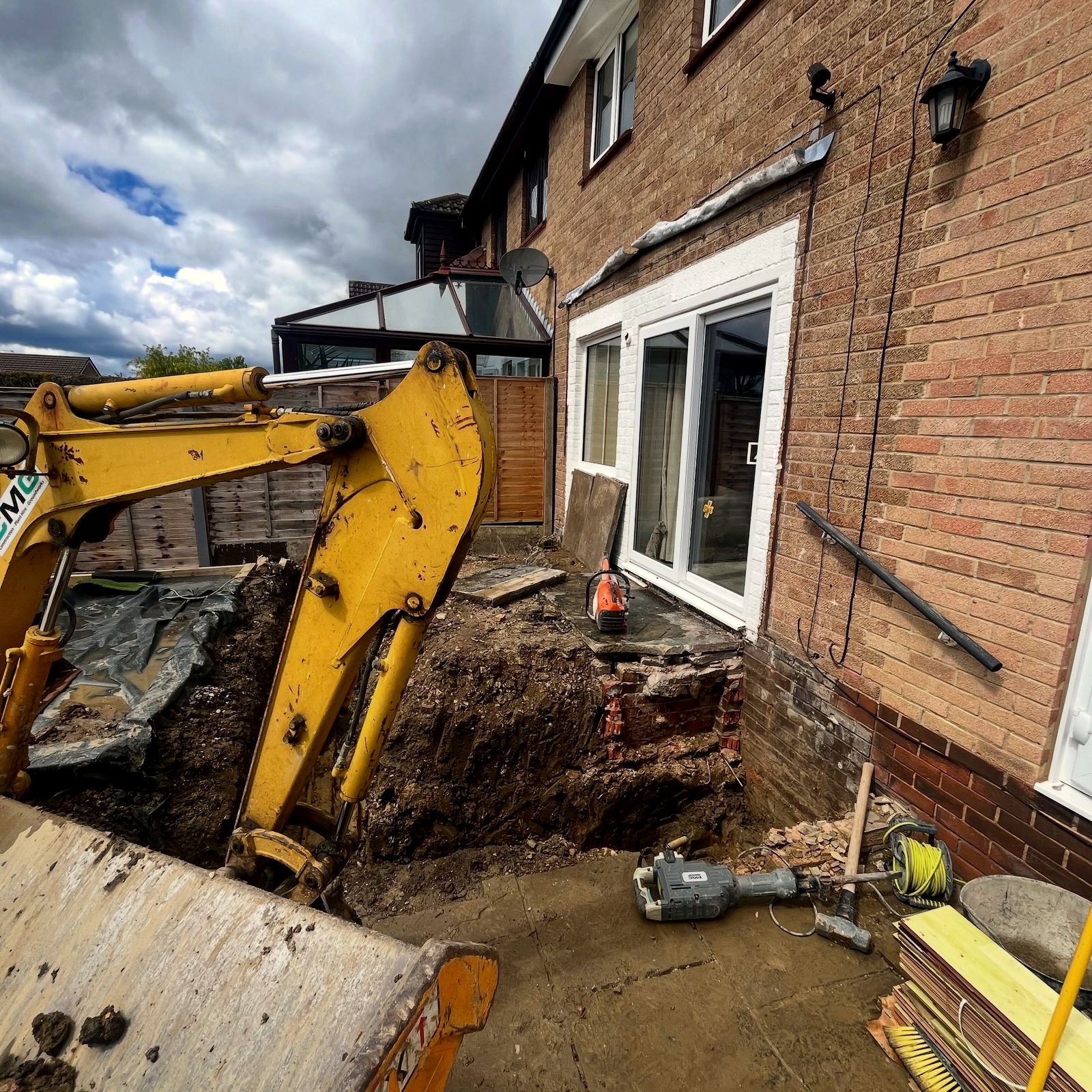 Rear extension foundations mid-excavation, before construction