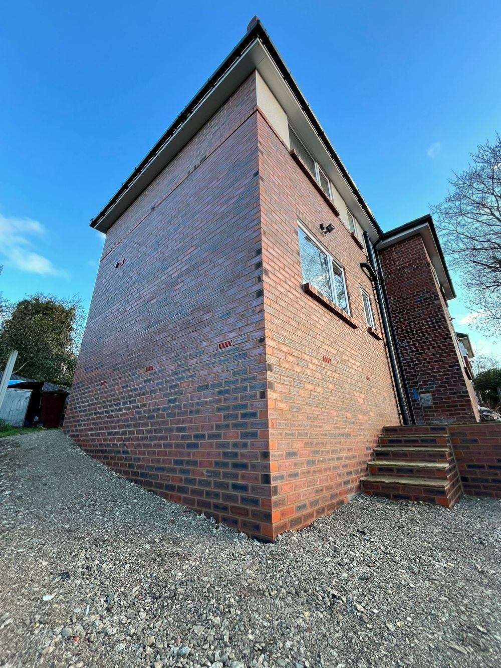Detail shot of matched brickwork on a two-storey rear extension