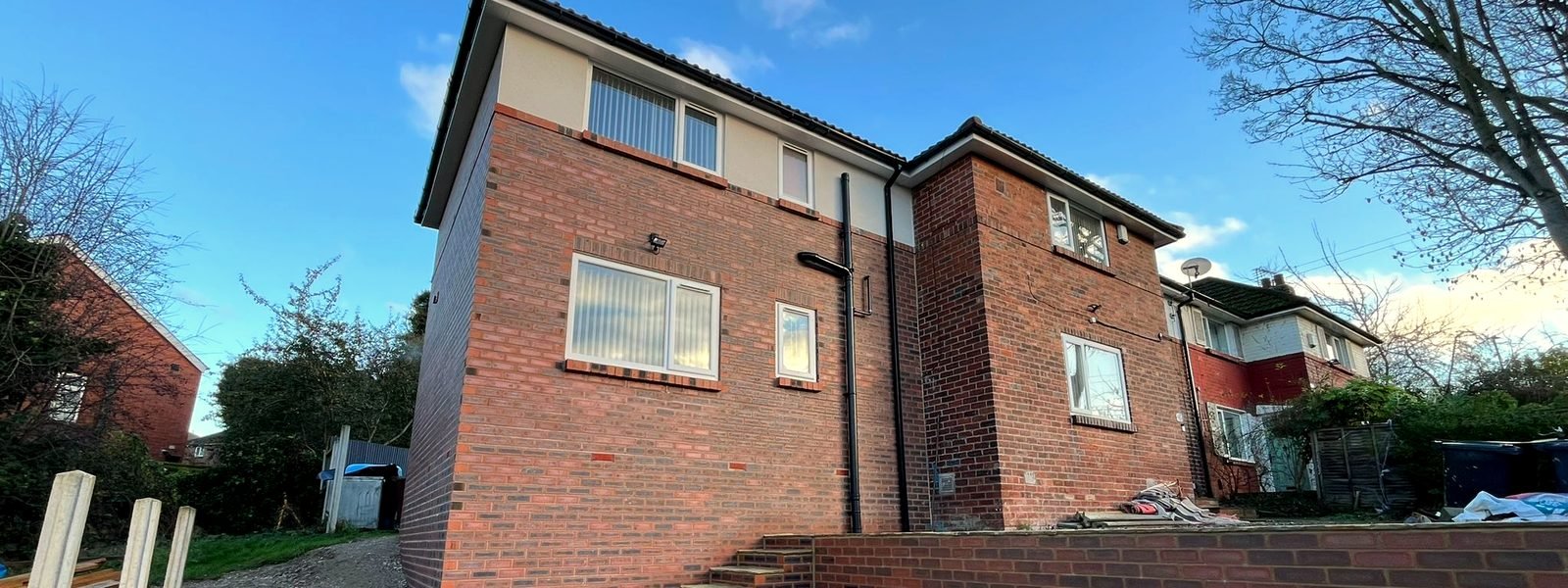 Completed two-storey brick rear extension with dormer window, Leeds