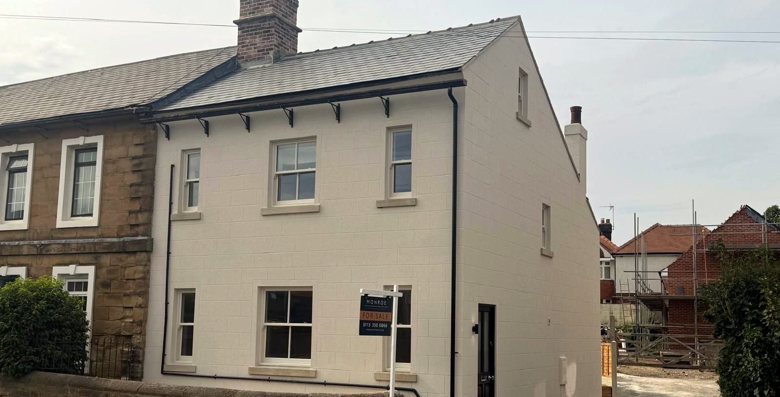 Fully rebuilt period property in Leeds, finished with painted render and sash windows