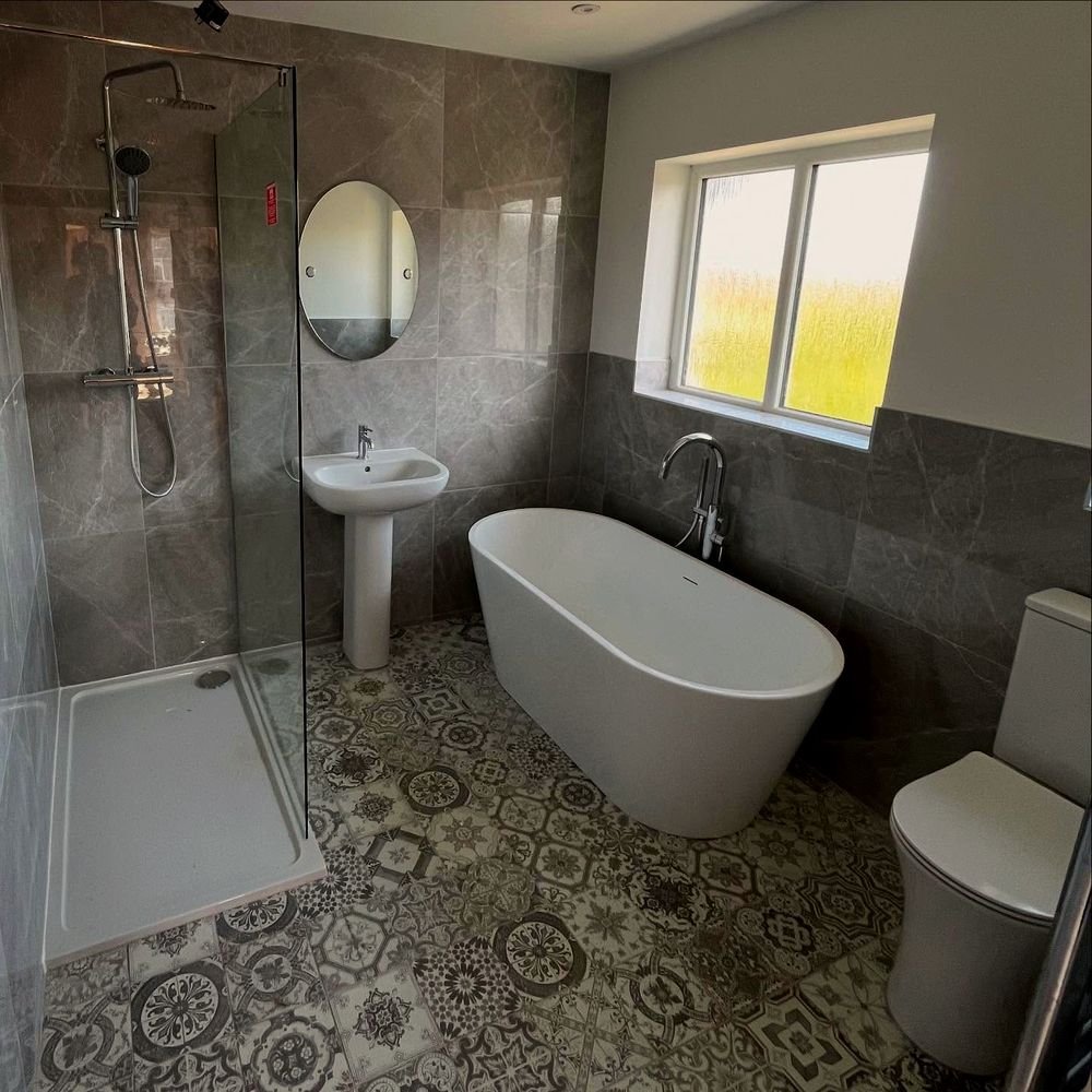 Freestanding bath and walk-in shower in a renovated bathroom